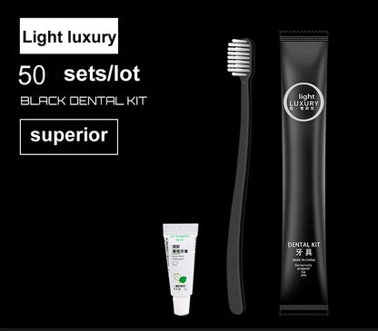 Black dental kit with toothbrush and toothpaste on a black background