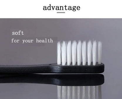 Black toothbrush with white bristles on a gray background, featuring the word 'advantage'.