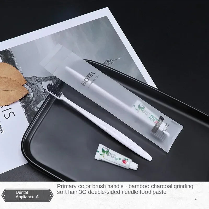 Toothbrush, toothpaste, and dental tools on a tray with a hotel magazine in the background.