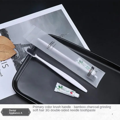 Toothbrush, toothpaste, and dental tools on a tray with a hotel magazine in the background.