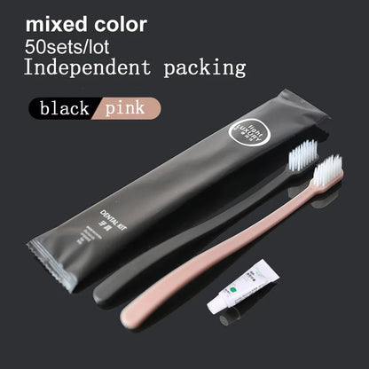 Black and pink toothbrushes with packaging on a black background
